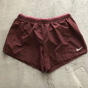 Nike purple/maroon running shorts